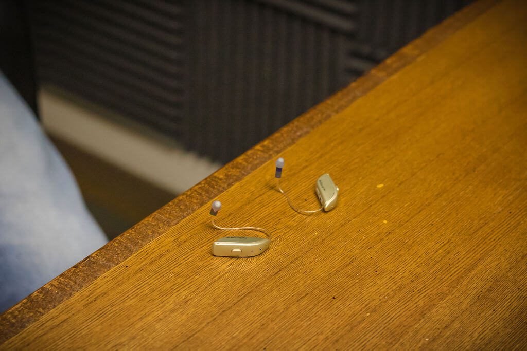 A pair of hearing aids on a table